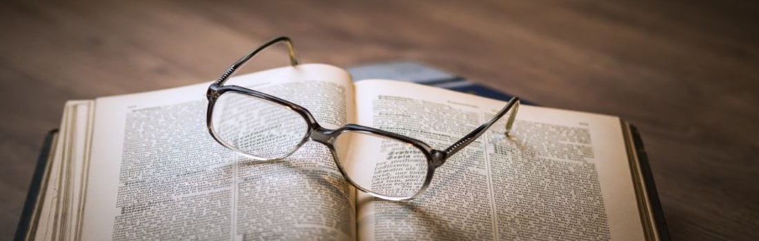 glasses sitting on a book