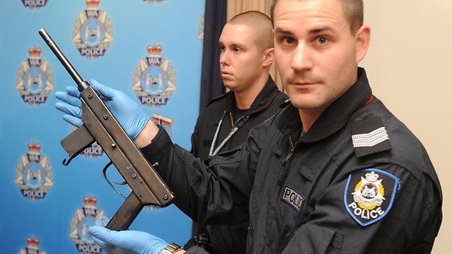 A police officer displays a homemade machine gun in Sydney, Australia.