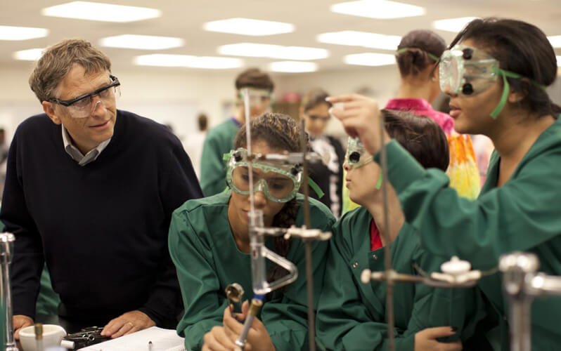 Bill Gates visits students in a chemistry lab - PolitiFact