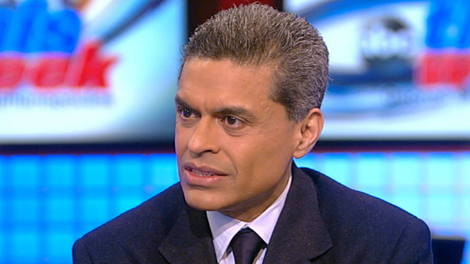Fareed Zakaria in front of a cnn-style background.