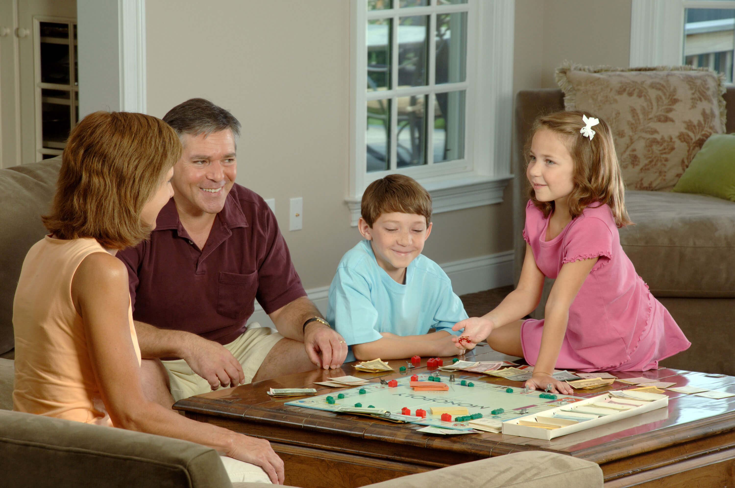 Family plays board game