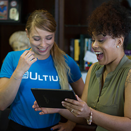 Ultius staff using a tablet