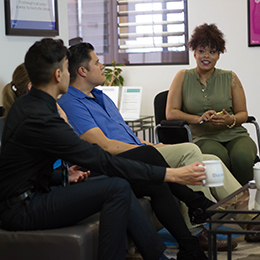 Teacher meeting with students.