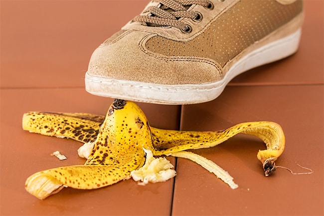 A shoe about to step on a banana